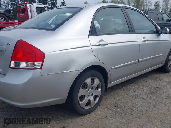 2009 Kia Spectra EX with VIN KNAFE221595659217, listed as a IAAI auction lot 42014406 with 140,527 mi miles. Bid and sale history available at carsss.com. Image 6.