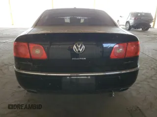 2004 Volkswagen Phaeton V8 z VIN WVWAF63D548010888, wystawiony jako Copart lot #77903574 z przebiegiem 68 511 mil mil oraz Szkody całkowita. Historia ofert i sprzedaży dostępna na DreamBid. Obrazek 6.