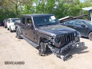2021 Jeep Gladiator High Altitude z VIN 1C6HJTFG1ML597581, wystawiony jako IAAI lot #42191690 z przebiegiem 47 740 mil mil oraz . Historia ofert i sprzedaży dostępna na DreamBid. Obrazek 1.