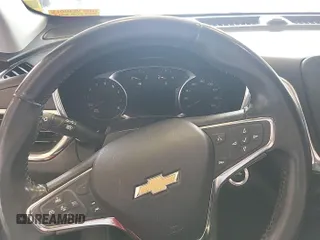 2020 Chevrolet Equinox LT with VIN 2GNAXJEV0L6236404, listed as a IAAI auction lot 42619695 with 77,124 mi miles and . Bid and sale history available at DreamBid. Image 3.