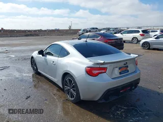2014 Subaru BRZ Limited with VIN JF1ZCAC11E8604633, listed as a IAAI auction lot 41466704 with 142,025 mi miles. Bid and sale history available at carsss.com. Image 3.