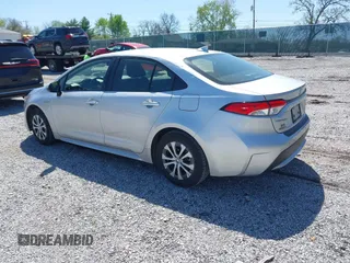 2021 Toyota Corolla Hybrid LE with VIN JTDEAMDE5MJ022110, listed as a IAAI auction lot 41912920 with 59,198 mi miles. Bid and sale history available at carsss.com. Image 3.
