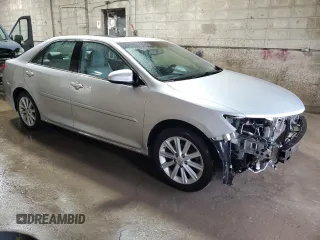 2014 Toyota Camry SE with VIN 4T1BK1FK0EU024666, listed as a Copart auction lot 52403395 with 129,728 mi miles and Salvage Title. Bid and sale history available at carsss.com. Image 4.
