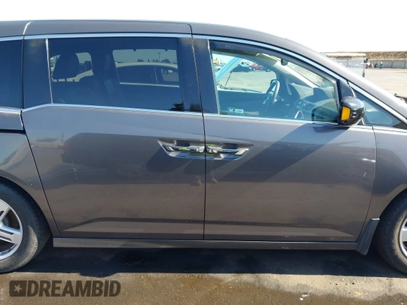 2012 Honda Odyssey Touring with VIN 5FNRL5H95CB057346, listed as a IAAI auction lot 42644094 with 114,712 mi miles and . Bid and sale history available at DreamBid. Image 14.