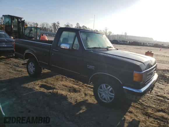 1990 Ford F-150 "S" with VIN 1FTDF15YXLNB40987, listed as a Copart auction lot 43691595 with 33,397 mi miles and Salvage Title. Bid and sale history available at carsss.com. Image 4.