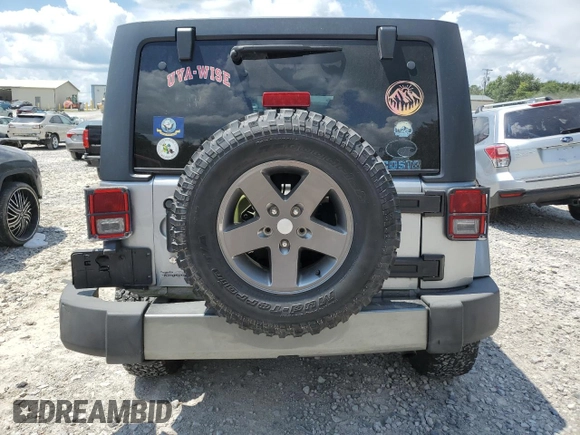 2013 Jeep Wrangler Unlimited Sport with VIN 1C4BJWDG4DL628518, listed as a Copart auction lot 65029795 with 142,852 mi miles and Salvage title. Bid and sale history available at DreamBid. Image 6.