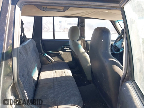 2001 Jeep Cherokee Sport with VIN 1J4FT48SX1L581192, listed as a IAAI auction lot 41828841 with 315,822 mi miles. Bid and sale history available at carsss.com. Image 8.