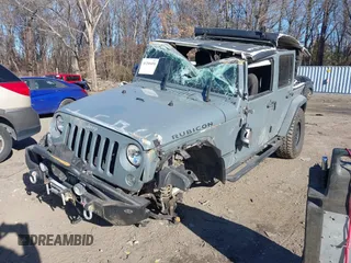 2014 Jeep Wrangler Unlimited Rubicon with VIN 1C4BJWFG3EL248164, listed as a IAAI auction lot 41290490 with 116,383 mi miles. Bid and sale history available at carsss.com. Image 2.