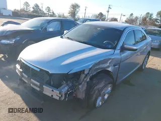 2014 Ford Taurus SEL z VIN 1FAHP2E87EG121069, wystawiony jako IAAI lot #41030422 z przebiegiem 138 043 mil mil oraz . Historia ofert i sprzedaży dostępna na DreamBid. Obrazek 2.