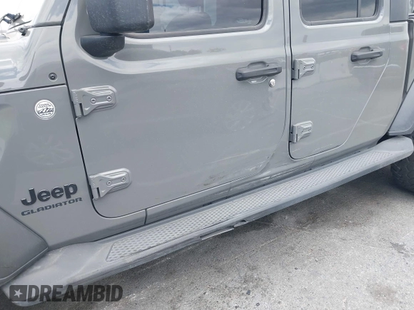 2020 Jeep Gladiator Sport S z VIN 1C6HJTAG4LL153441, wystawiony jako IAAI lot #42052329 z przebiegiem 34 660 mil mil oraz . Historia ofert i sprzedaży dostępna na DreamBid. Obrazek 6.
