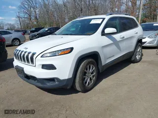 2015 Jeep Cherokee Latitude with VIN 1C4PJMCS1FW795579, listed as a IAAI auction lot 41661163 with 108,246 mi miles. Bid and sale history available at carsss.com. Image 2.