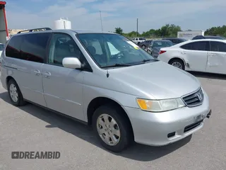 2003 Honda Odyssey EX-L with VIN 5FNRL18023B099998, listed as a IAAI auction lot 42220308 with 221,002 mi miles and . Bid and sale history available at DreamBid. Image 1.