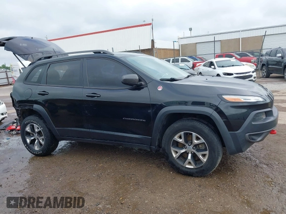 2015 Jeep Cherokee Trailhawk with VIN 1C4PJMBS5FW647601, listed as a IAAI auction lot 42437734 with 170,640 mi miles and . Bid and sale history available at DreamBid. Image 14.