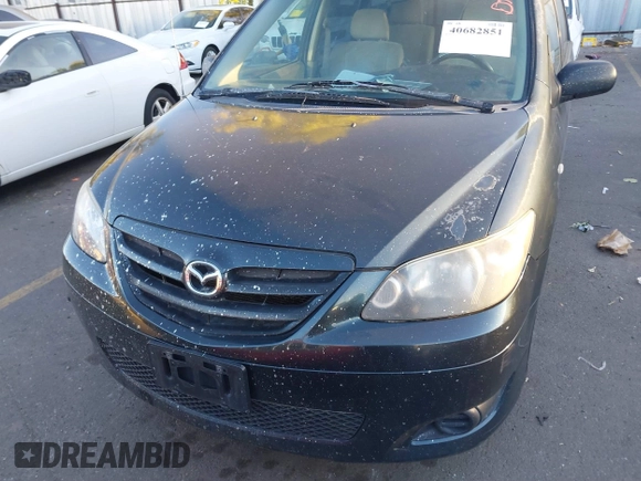 2005 Mazda MPV LX with VIN JM3LW28A650547549, listed as a IAAI auction lot 40682851 with 212,438 mi miles. Bid and sale history available at carsss.com. Image 12.