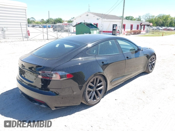 2021 Tesla Model S Plaid with VIN 5YJSA1E66MF452258, listed as a IAAI auction lot 41832000 with 42,845 mi miles and . Bid and sale history available at DreamBid. Image 4.