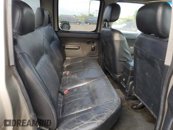 2004 Nissan Frontier LE z VIN 1N6ED27T14C460890, wystawiony jako Copart lot #55610435 z przebiegiem 218 988 mil mil oraz Szkoda całkowita • Salvage title. Historia ofert i sprzedaży dostępna na DreamBid. Obrazek 10.