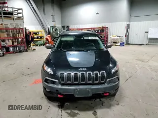 2014 Jeep Cherokee Trailhawk with VIN 1C4PJMBS5EW294212, listed as a Copart auction lot 88816885 with 151,779 mi miles and Salvage title. Bid and sale history available at DreamBid. Image 12.