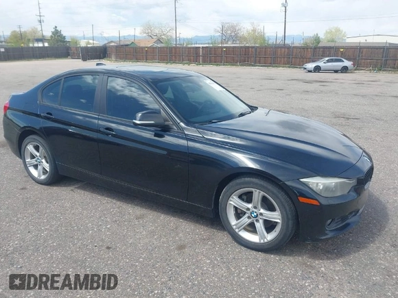 2014 BMW 3 Series 328i xDrive with VIN WBA3B3C56EJ981322, listed as a IAAI auction lot 42104530 with 104,376 mi miles. Bid and sale history available at carsss.com. Image 1.