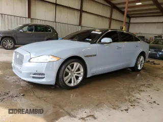 2013 Jaguar XJ with VIN SAJWJ1CD1D8V51462, listed as a Copart auction lot 50527985 with 62,995 mi miles and Salvage Title. Bid and sale history available at carsss.com. Image 1.