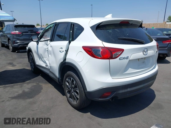 2016 Mazda CX-5 Grand Touring z VIN JM3KE2DY2G0824802, wystawiony jako IAAI lot #42170591 z przebiegiem 53 173 mil mil oraz . Historia ofert i sprzedaży dostępna na DreamBid. Obrazek 3.