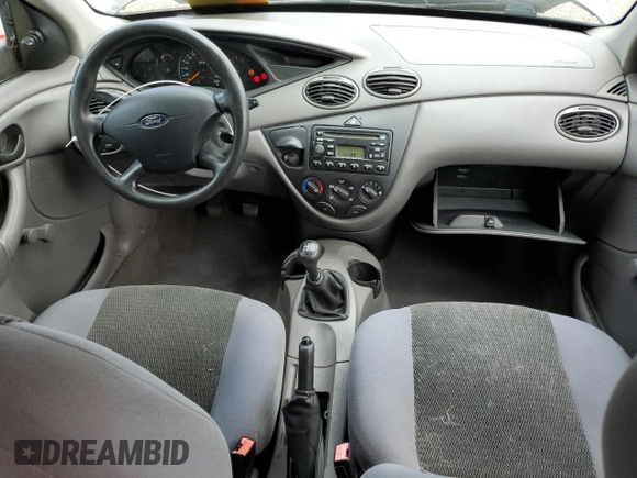 2004 Ford Focus LX with VIN 1FAFP33P24W148563, listed as a Copart auction lot 63869755 with 142,243 mi miles and Salvage title. Bid and sale history available at DreamBid. Image 8.