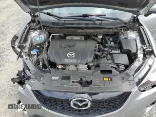 2014 Mazda CX-5 Touring z VIN JM3KE4CY0E0407169, wystawiony jako Copart lot #57877215 z przebiegiem 168 277 mil mil oraz Szkoda całkowita • Salvage title. Historia ofert i sprzedaży dostępna na DreamBid. Obrazek 12.