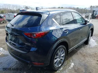 2021 Mazda CX-5 Grand Touring with VIN JM3KFADM1M1356538, listed as a IAAI auction lot 41723485 with 91,925 mi miles. Bid and sale history available at carsss.com. Image 4.