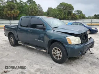 2006 Nissan Titan LE z VIN 1N6BA07B16N557411, wystawiony jako Copart lot #86058634 z przebiegiem 263 198 mil mil oraz Szkody całkowita. Historia ofert i sprzedaży dostępna na DreamBid. Obrazek 4.