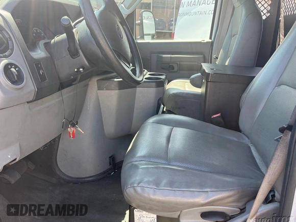 2013 Ford Econoline Cargo Commercial with VIN 1FTNE1ELXDDA44828, listed as a IAAI auction lot 42219008 with 174,965 mi miles. Bid and sale history available at carsss.com. Image 1.