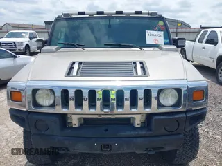 2003 Hummer H2 with VIN 5GRGN23U23H148326, listed as a IAAI auction lot 42068326 with 149,396 mi miles. Bid and sale history available at carsss.com. Image 12.