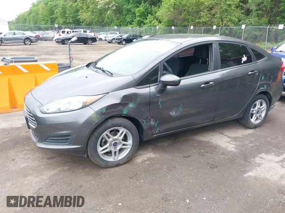 2019 Ford Fiesta SE z VIN 3FADP4BJ7KM155094, wystawiony jako IAAI lot #42186126 z przebiegiem 93 684 mil mil oraz . Historia ofert i sprzedaży dostępna na DreamBid. Obrazek 19.