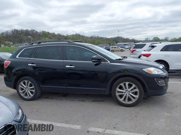 2011 Mazda CX-9 Grand Touring z VIN JM3TB2DAXB0300466, wystawiony jako IAAI lot #41921411 z przebiegiem 196 257 mil mil oraz . Historia ofert i sprzedaży dostępna na DreamBid. Obrazek 13.