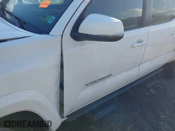 2023 Toyota Tacoma 4WD SR with VIN 3TMCZ5AN1PM538367, listed as a IAAI auction lot 41468684 with 28,879 mi miles. Bid and sale history available at carsss.com. Image 18.