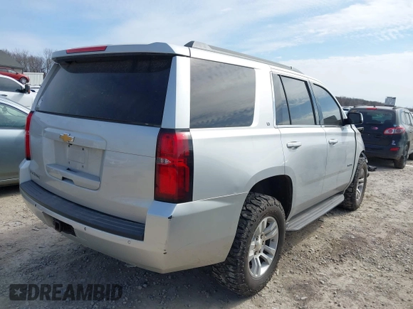 2015 Chevrolet Tahoe LT with VIN 1GNSCBKC4FR552034, listed as a IAAI auction lot 41891302 with 145,969 mi miles and . Bid and sale history available at DreamBid. Image 4.