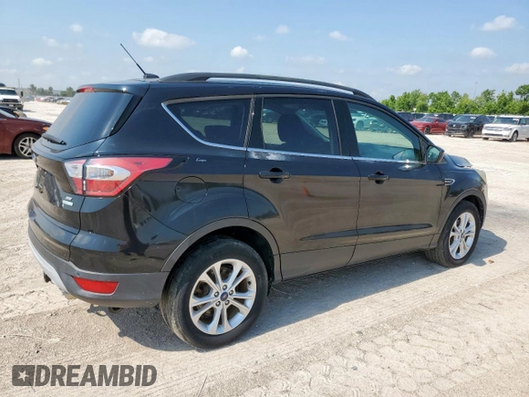 2017 Ford Escape SE z VIN 1FMCU0GD2HUC07371, wystawiony jako Copart lot #59223875 z przebiegiem 26 805 mil mil oraz Szkoda całkowita • Salvage title. Historia ofert i sprzedaży dostępna na DreamBid. Obrazek 3.