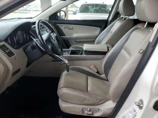 2012 Mazda CX-9 Grand Touring with VIN JM3TB3DV2C0336355, listed as a Copart auction lot 61687975 with 150,580 mi miles and Salvage title. Bid and sale history available at DreamBid. Image 7.