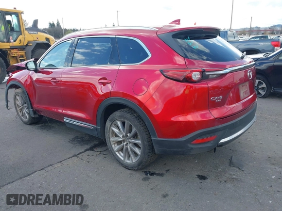 2020 Mazda CX-9 Grand Touring with VIN JM3TCBDY4L0423563, listed as a IAAI auction lot 41829394 with 76,704 mi miles and . Bid and sale history available at DreamBid. Image 3.