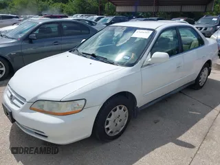 2002 Honda Accord LX z VIN 1HGCG56482A067556, wystawiony jako IAAI lot #42494292 z przebiegiem 209 511 mil mil oraz . Historia ofert i sprzedaży dostępna na DreamBid. Obrazek 2.