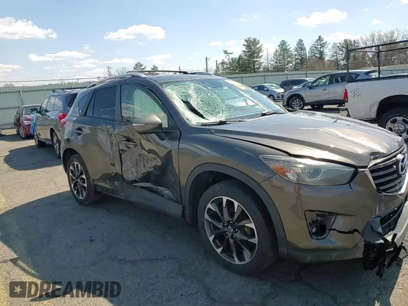 2016 Mazda CX-5 Grand Touring with VIN JM3KE4DY1G0806674, listed as a Copart auction lot 50549465 with 139,753 mi miles and Salvage Title. Bid and sale history available at carsss.com. Image 11.