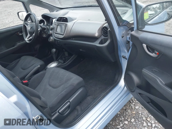 2009 Honda Fit Sport w/Navi with VIN JHMGE886X9S042490, listed as a IAAI auction lot 41931712 with 111,088 mi miles. Bid and sale history available at carsss.com. Image 5.