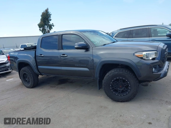 2019 Toyota Tacoma SR with VIN 3TMCZ5AN3KM207783, listed as a IAAI auction lot 42375280 with 55,784 mi miles and . Bid and sale history available at DreamBid. Image 14.
