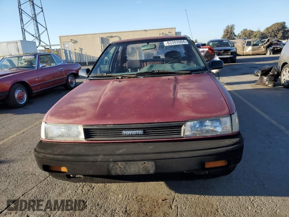 1989 Toyota Corolla with VIN JT2AE92E4K0112945, listed as a Copart auction lot 83382604 with 209,462 mi miles and Salvage title. Bid and sale history available at DreamBid. Image 5.