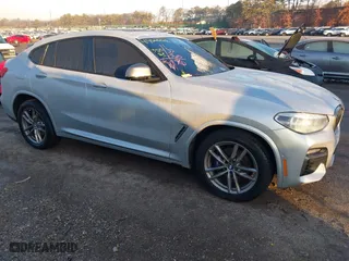 2021 BMW X4 M40i with VIN 5UX2V5C07M9H92332, listed as a IAAI auction lot 41466662 with 35,081 mi miles. Bid and sale history available at carsss.com. Image 1.