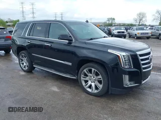 2015 Cadillac Escalade Luxury z VIN 1GYS4BKJ1FR157470, wystawiony jako IAAI lot #42173164 z przebiegiem 172 687 mil mil oraz . Historia ofert i sprzedaży dostępna na DreamBid. Obrazek 1.