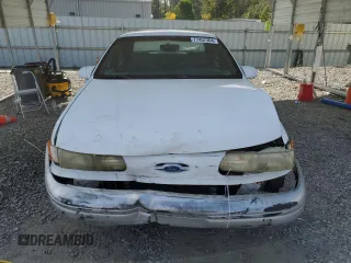 1992 Ford Taurus GL z VIN 1FALP52U5NA280821, wystawiony jako Copart lot #77457304 z przebiegiem 33 484 mil mil oraz Szkoda całkowita • Salvage title. Historia ofert i sprzedaży dostępna na DreamBid. Obrazek 5.