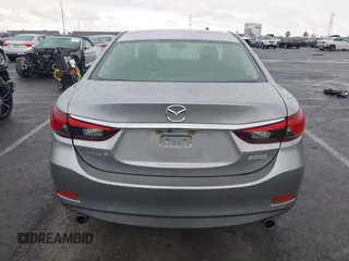 2014 Mazda 6 i Touring with VIN JM1GJ1V60E1141831, listed as a IAAI auction lot 42131200 with 86,597 mi miles and . Bid and sale history available at DreamBid. Image 16.