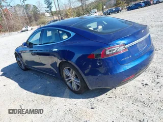 2016 Tesla Model S 90D with VIN 5YJSA1E25GF144614, listed as a IAAI auction lot 40941311 with 83,587 mi miles and . Bid and sale history available at DreamBid. Image 3.