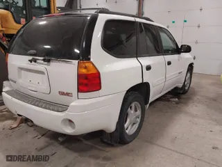 2004 GMC Envoy SLE with VIN 1GKDT13S042173138, listed as a IAAI auction lot 41340595 with 111,282 mi miles. Bid and sale history available at carsss.com. Image 4.