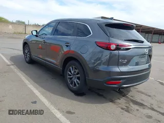 2021 Mazda CX-9 Sport with VIN JM3TCBBY7M0520437, listed as a IAAI auction lot 42022562 with 77,063 mi miles and . Bid and sale history available at DreamBid. Image 3.