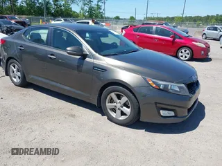 2014 Kia Optima LX with VIN 5XXGM4A71EG335165, listed as a IAAI auction lot 42052378 with 154,574 mi miles. Bid and sale history available at carsss.com. Image 1.